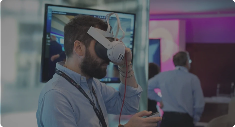 Man exploring virtual reality at a tech event