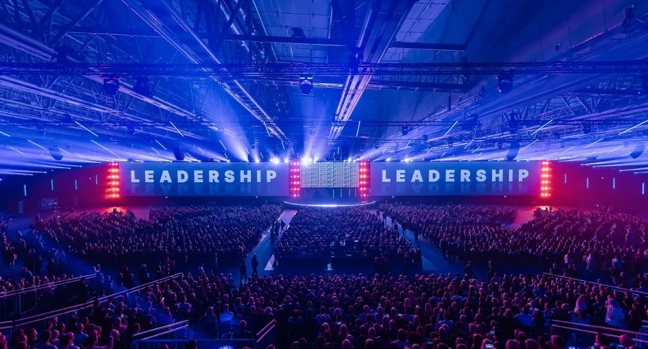 Large-scale corporate leadership conference with full audience
